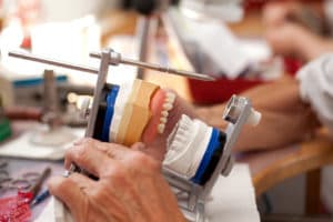 Denture articulator used for repairs and adjustments