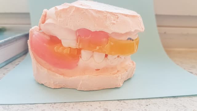 Patient receiving immediate denture fitting