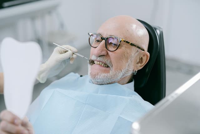 Senior man smiling during a comfortable dental appointment