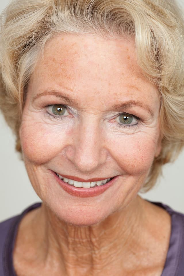 Confident senior woman with a warm, natural smile